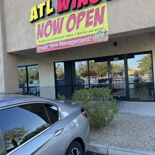 a car parked in front of a restaurant