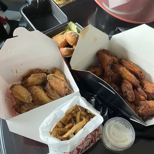 garlic parmesan and honey habanero traditional wings with atl fries and fried biscuits