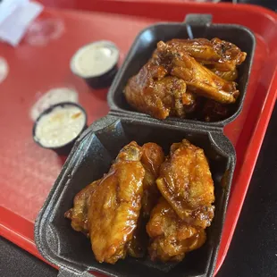 two trays of chicken wings