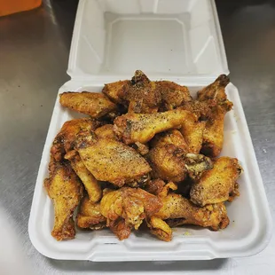 chicken wings in a styrofoam container