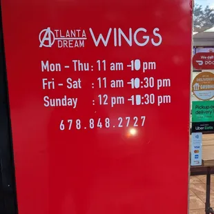 a red sign with the words atlanta dream wings on it