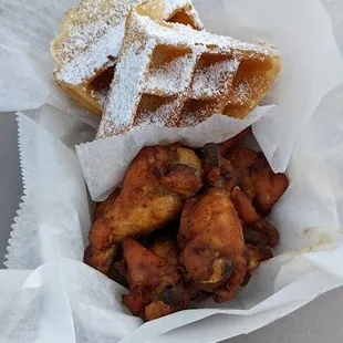 a basket of fried peach wings