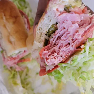 Initial first bite of my Italian sub. It was so huge I couldn&apos;t fit all of it in my mouth with one bite. Delicious!