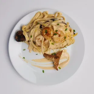 a plate of pasta and mushrooms