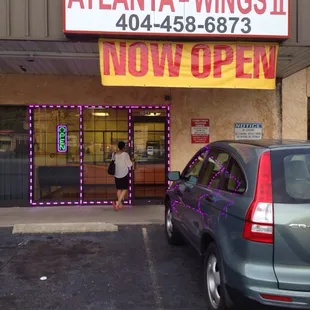 a car parked in front of a business