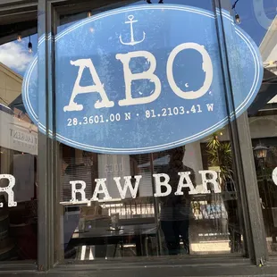 a man standing in front of a bar