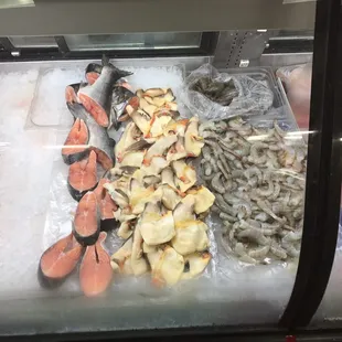 Fresh salmon steak, conch meat, and shrimp