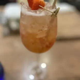 a close up of a drink with strawberries