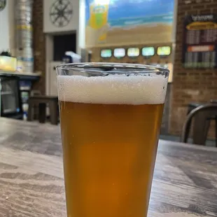 a pint of beer on a table