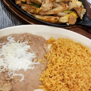 Combo fajitas with beans and rice. It didnt come with any toppings! I got a small ramekin of cheese and charged $1.00. Not worth the price!