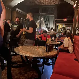 a group of people sitting around a table