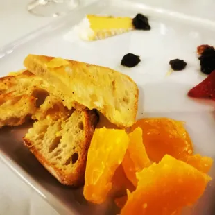 a plate of fruit and bread