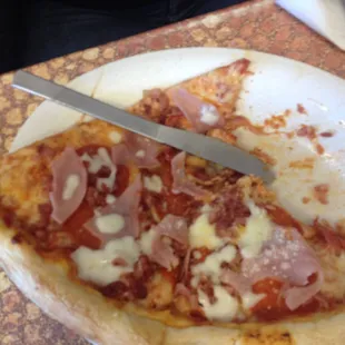 Pepperoni ham and bacon pizza. Lunch special