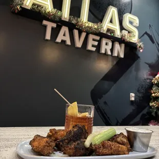 Wings and signature cocktail.
