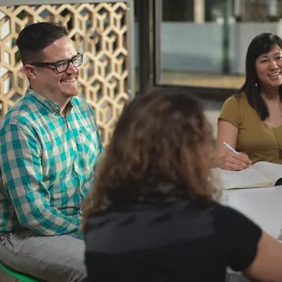 Coworkers focused on building their business while helping others along (it's a cycle, you see)