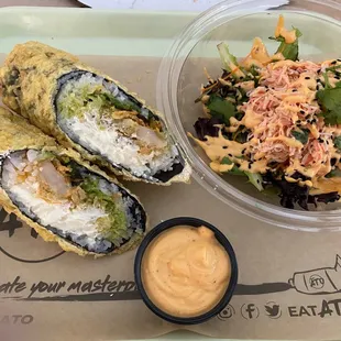 Tempura shrimp burrito with cream cheese, avocado, and mixed greens plus a side of crab mix