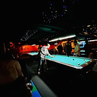 a man playing pool