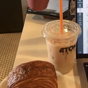 iced chai latte and a chocolate croissant