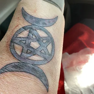 The triple goddess w/ a pentacle - a pentacle is a good luck talisman - 5 pts = spirit, earth, air, fire, water