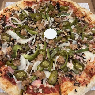 Atomic pizza! Ingredients overboard! So delicious!