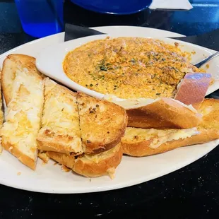 Homemade crab dip with garlic bread.