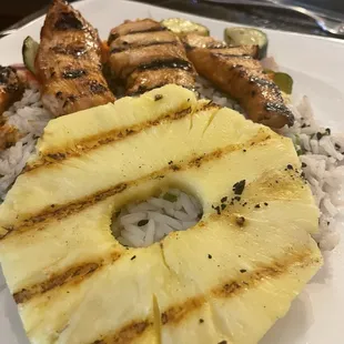 Bourbon glazed chicken skewers. With a large piece of pineapple.