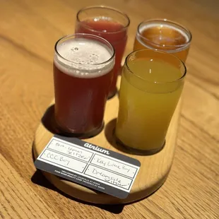 three glasses of beer on a wooden table