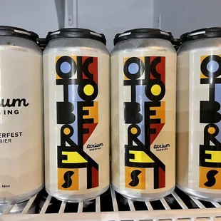 four cans of beer on a shelf