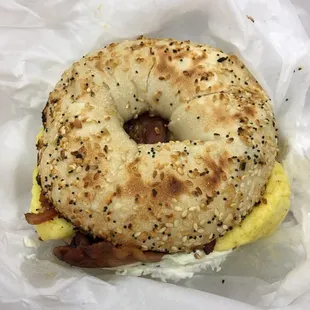 Bacon, egg &amp; cheese on an everything bagel sandwich