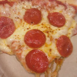 a slice of pepperoni pizza