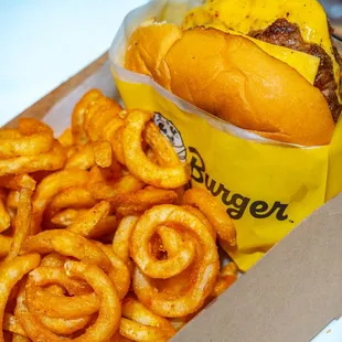 a box of onion rings and a hot dog