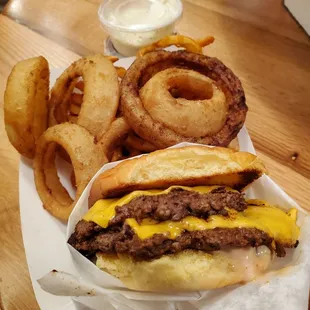 Double smash burger ($12.00) with The 50/50 ($7.00), aka mix of onion rings and curly fries