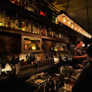 a man behind a bar counter