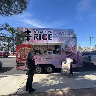 a woman standing in front of a truck