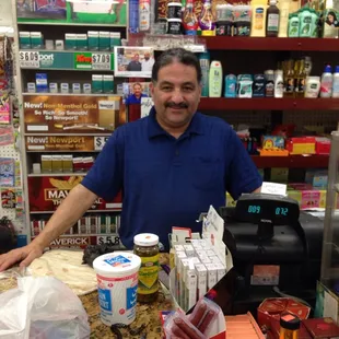 a man standing behind a counter