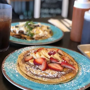 Chliequiles with steak  and pancakes