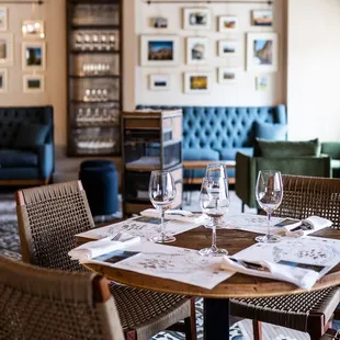 a dining table with wine glasses on it