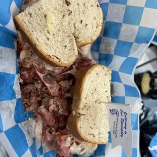Corn beef and pastrami with sauerkraut, thousand Allen dressing on  Rye bread.