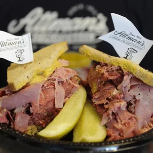 a corned beef sandwich with pickles