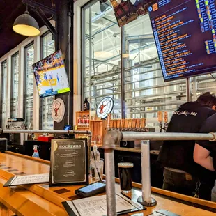 a man and a woman sitting at a bar