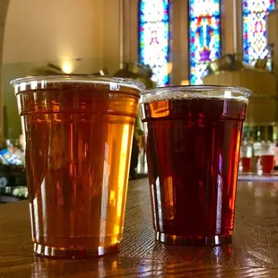 two pints of beer on a bar