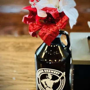 a beer bottle with a flower in it