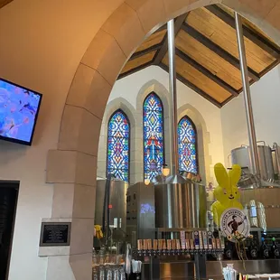 Church stained glass behind the bar