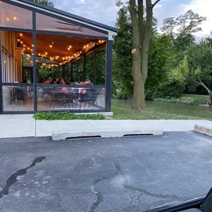 Patio seating along the Huron River in Downtown Flat Rock.