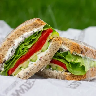 Spring Vegetable Sandwich - red pepper, marinated cucumber, asparagus, red onion, lettuce, goat cheese &amp; olive spread, on 7 Grain &amp; Flax.