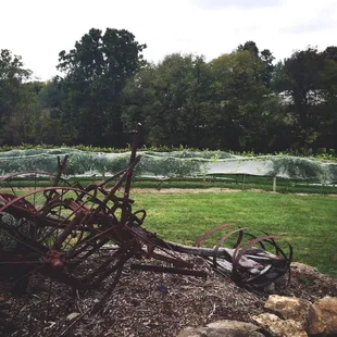an old plow in the foreground