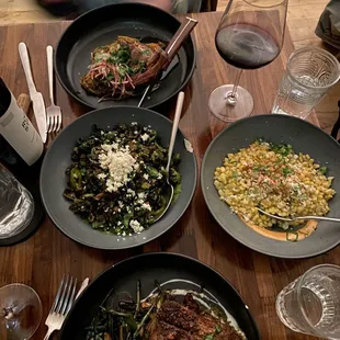 Top to bottom: borrego con fideos (lamb), Brussels sprouts, esquites and carne asada