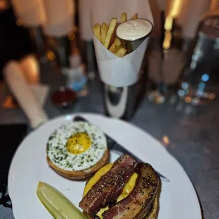 Single cheeseburger with bacon and fries egg