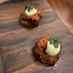 two appetizers on a cutting board