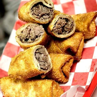 a pile of fried food on a red and white checkered tray
